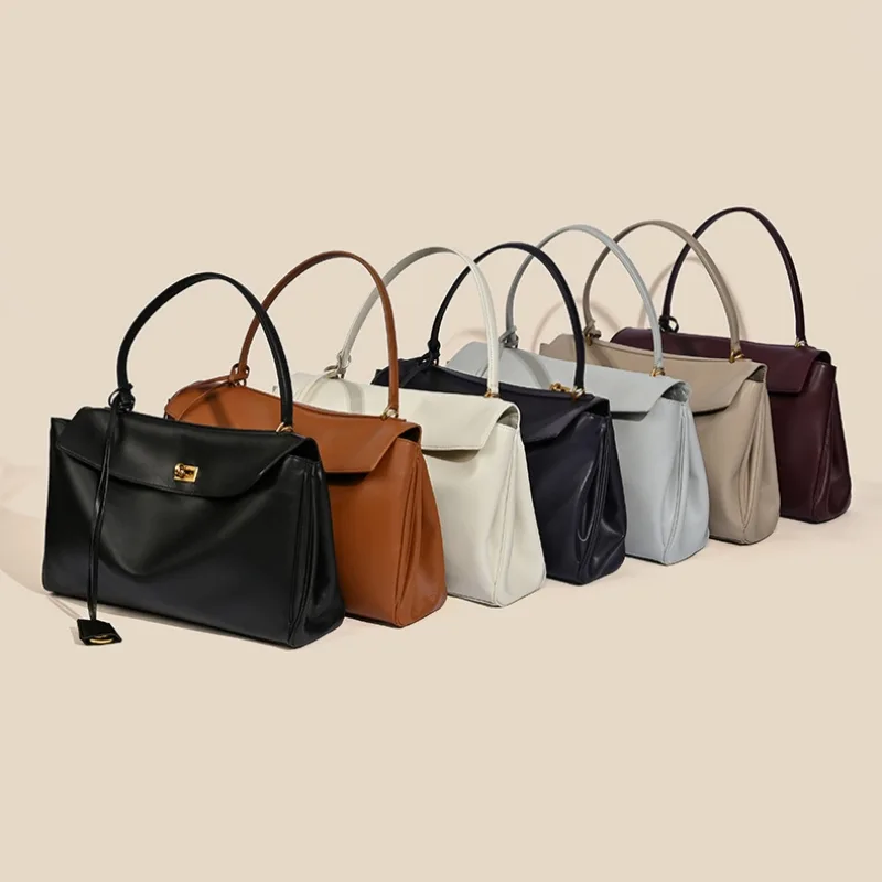 Collection of stylish handbags in rows.