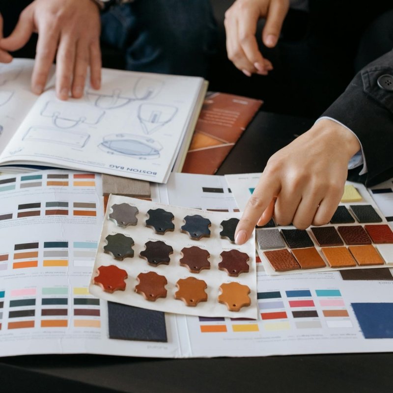 Hands selecting color samples and materials